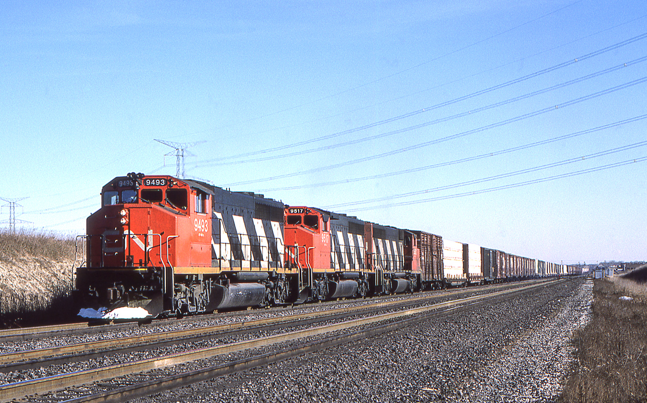 Peter Jobe photographed CN 9493 with train #218 at Maple, Ontario on November 19, 1986.