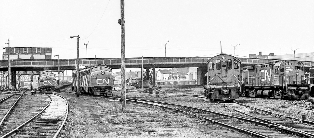 It is mid-June 1970 at the CN Spadina engine facility in Toronto. CN 3232 and others can be seen.