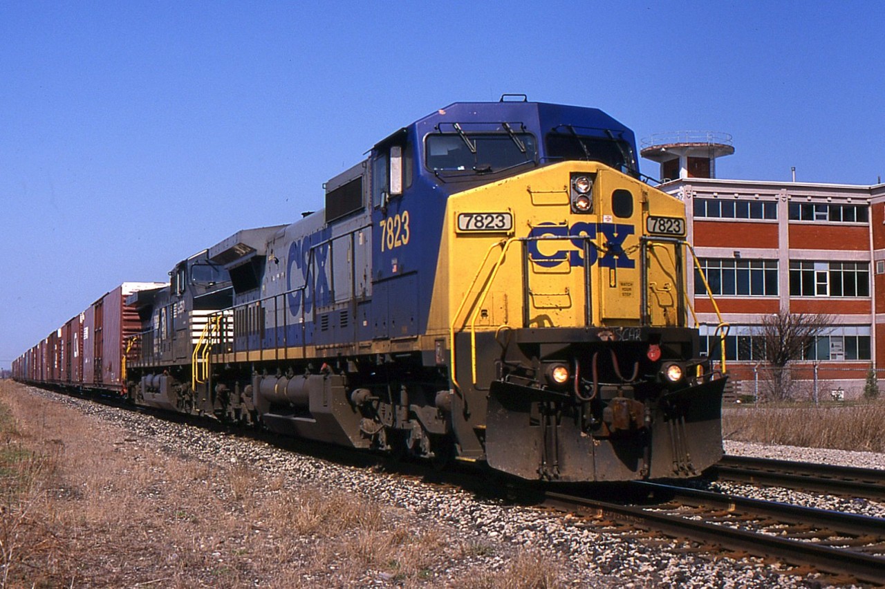 CSX C40-8W leads NS 328 through St. Catharines on the CN Grimsby Sub in 2001.
