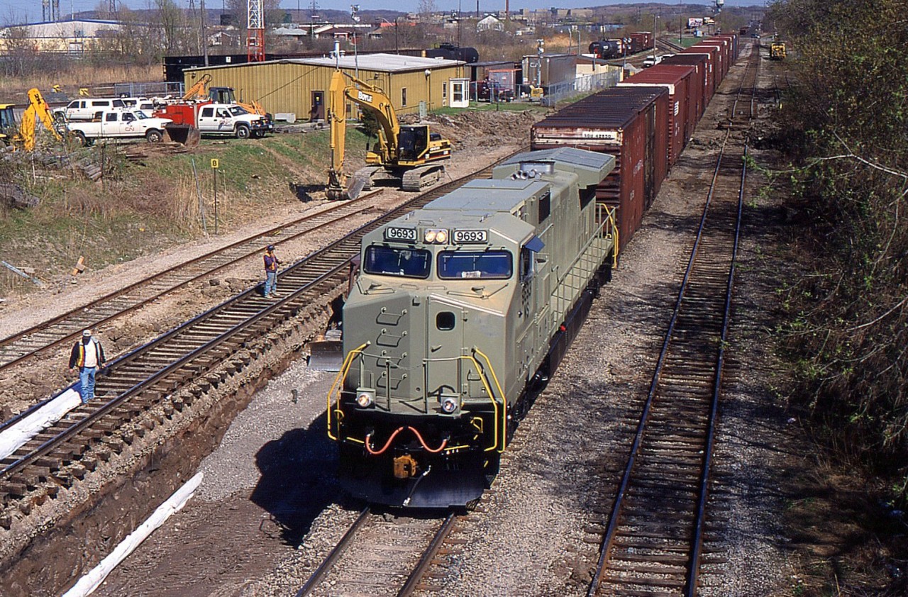 NS99 with NS C40-9W 9693 passing through Rule 42 limits at Merritton during the time when they lowered both north and south tracks to allow for double stacks to fit under Merritt St. Bridge.