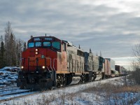 Keewatin Railway's signature mixed train is seen northbound at Root Lake Manitoba with GP40-2W HBRY 3005 and M-420W KRC 2401 up front.  Behind the power are a pair of flat cars bracketed by a set of HBRY 40 foot box cars followed by the passenger portion of the train.  I can't remember what led me up to this portion of the country in late November but I would certainly like to do it again in the summer.  