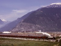 On the first day, Tuesday 1974-06-18, that former CP Royal Hudson 2860 made a trip on the British Columbia Railway from North Vancouver to Squamish, here she and her train are northbound under the watchful eye of ~1700-metre (~5660 feet) Mount Murchison, with the Squamish docks in the background and the Woodfibre pulp mill in the distance on the far left.