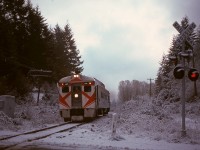 CP tried reversing the Victoria-Courtenay-Victoria schedule of its Dayliner on Vancouver Island from 1975-04-26 to 1975-11-15, and when ridership did not support that, returned to the original plan.  One minor challenge was the operating timetable still showed the reversed timing, so for two weeks (until Supplement 1 to Timetable 95 was effective on 1975-11-30), Passenger Extra provisions were utilized, illustrated here on the second day at 0855 PST on Tuesday 1975-11-18 with 9103 carrying white flags and classification lights and crossing Shawnigan Lake Road immediately north of Malahat station.