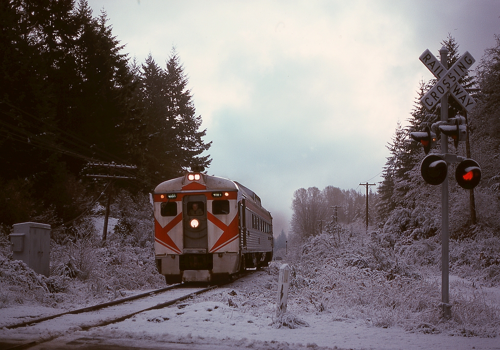 CP tried reversing the Victoria-Courtenay-Victoria schedule of its Dayliner on Vancouver Island from 1975-04-26 to 1975-11-15, and when ridership did not support that, returned to the original plan.  One minor challenge was the operating timetable still showed the reversed timing, so for two weeks (until Supplement 1 to Timetable 95 was effective on 1975-11-30), Passenger Extra provisions were utilized, illustrated here on the second day at 0855 PST on Tuesday 1975-11-18 with 9103 carrying white flags and classification lights and crossing Shawnigan Lake Road immediately north of Malahat station.