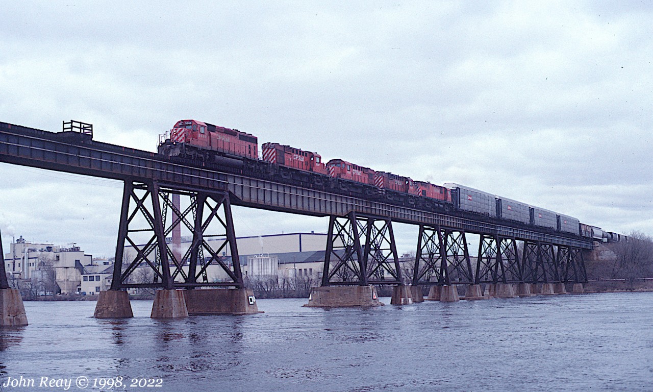 Part of an extended CP Belleville sub chase from 1998
From Trenton ON to Pickering ON, on an unfortunately dull April day.
This is probably train 505 (the successor to old train 927.)
We have SD40-2 #5568 leading RS-18us #1837,1828,1853 and an unidentified C-424..
The waning days of 4-axle MLW power. Even the GMDD leader is now a welcome change from the endless parade of GEs today.

1. Seen first crossing the trestle over the Trent river at Trenton ON.