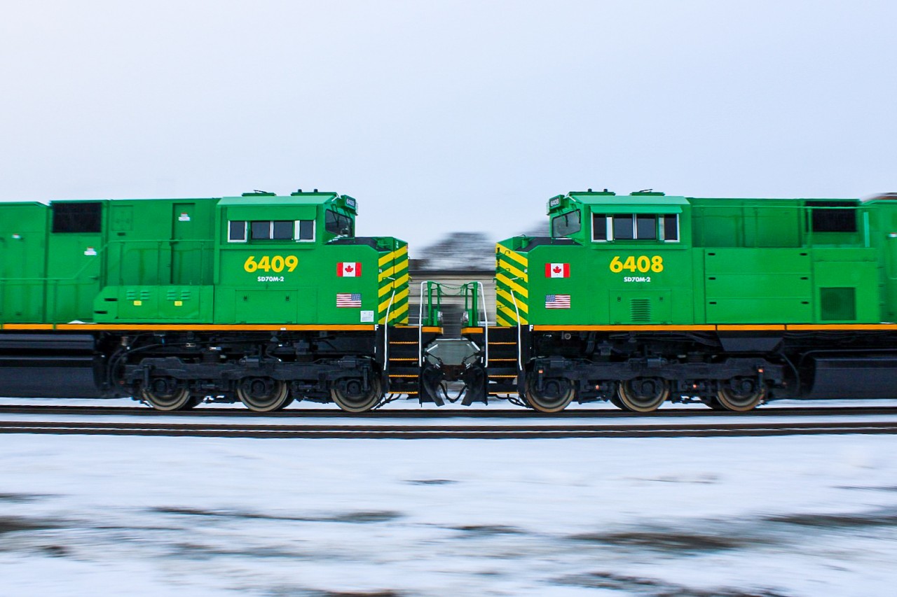 With railfans across the GTA scattering to photograph the NBSR SD70M-2s on 2-230 on a Saturday afternoon, many were opting for wider yet difficult shots where one could frame all 4 cleanly into one shot. I had been instead wasting time away near MacMillan Yard in Vaughan with friends in the hopes we would be ready for the slim chance BCOL 4644's presence would yield a departure in that day. With confirmation of the lead units on the last 2 outbound trains via scanner and a notification that 2-230 began working Lambton, I scrambled back to the North Toronto Sub with one of said friends, sacrificing some of our other options for locations by instead sticking to locations with fastest public transit access. My friend went for the Howland Signals about 200m west of me whilst I found a little opening in the foliage with a clean line of sight for about 20 metres from the tracks, ideal for panning. Using an unreliable, yet tried and true method of spraying and praying, this frame became part of the yield.