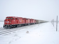 CP# E07-14 departs an ice fog covered Regina with a trio of consecutively numbered SD40-2Fs up front, and 6600ft of grain in tow.  