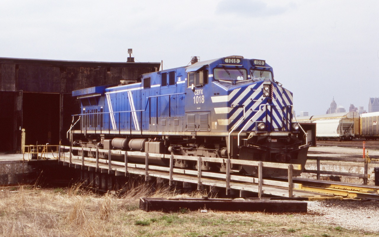 My trips to Windsor are far and few but did stop by CP a few times during those trips. This day it was a nice treat catching CEFX 1018 ( built to UP specs) sitting on the old turntable with a bit of the Detroit skyline in the background. Sadly today the roundhouse is gone and the turntable disconnected.