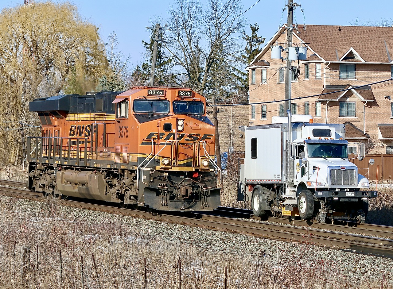 Yes the Galt subdivision almost seems dead enough somedays you probably could drag race on it, LOL, but this was not the case. Light power CP train 234 has BNSF 8375 fir power as it rolls past a track inspection vehicle in Streetsville on a sun but cold winters day.