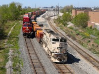 CP 7021 ‘Arid Regions Army Tribute Unit’ bringing up the tail end of CP 113-13, coming to a stop on north main track in Agincourt yard for trade off and refuel, CP 8149 leading CP 112 waiting patiently for the light at Neilson to depart. 
