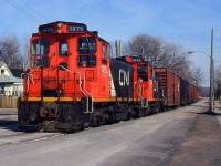  549 with CN SW1200RS 1375 and 1374 head up the Townline Rd. to Interlake Paper back in Dec of 1998, this was before Trillium Railway took over.
