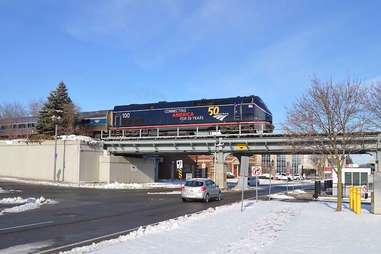 This is only the second of the special "50 Years" series wraps I have seen on the Amtrak train "Maple Leaf" which runs between Toronto and New York City.  Image is where Bridge St meets River Rd in Niagara Falls.  Number 100 looks good in its Midnight Blue on what has been a rather infrequent sunny day lately.