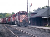 Another one of those days when the cloud and fog have rolled in off of Georgian Bay.  Didn't really matter. I would have been shooting right into the sun if it was out.  CP 5796, 5535 and 5921 are seen northbound past the old Parry Sound station on  a dull but very humid afternoon.  I've always liked this photo because of the Parry Sound station sign. It now hangs proudly in my garage.