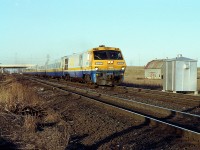 Late day scene; I don't recall VIA #75 powered by LRC-only so not sure what number this passenger is. But it is westbound. One of a rather unreliable fleet of BBD locomotives, this LRC-2 6908 was sold to CAD Rail Services in 1999; renumbered as their 2000 and scrapped in 2003.
No doubt this location pictured will be puzzling to some locals.  That is a QEW bridge in the background, and the barn was razed for the future IKEA complex that now occupies this once fertile field.