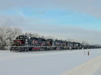 On a cold frosty New Years eve Cando Contracting are delivering tank cars to the Dow chemical plant in Fort Saskatchewan.  The consist comprises 3 GP 38-2s, CCGX 4214, 4215, 4216 and GP9u 4024 
