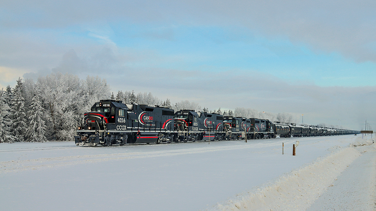 On a cold frosty New Years eve Cando Contracting are delivering tank cars to the Dow chemical plant in Fort Saskatchewan.  The consist comprises 3 GP 38-2s, CCGX 4214, 4215, 4216 and GP9u 4024