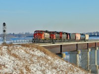 CN 5292, 5329 and 5357 bring a short train 512 from Scotford Yard across the North Saskatchewan River to head up the Beamer Industrial Spur. 