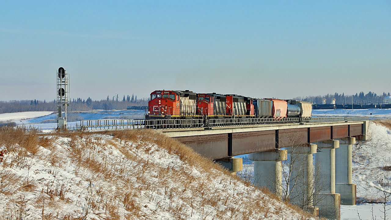 CN 5292, 5329 and 5357 bring a short train 512 from Scotford Yard across the North Saskatchewan River to head up the Beamer Industrial Spur.
