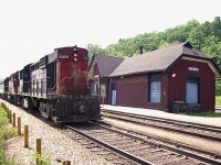 One of the drawbacks about hanging out at the old Dundas station was the fact eastbound trains in the late
afternoon posed a terrible sun angle for shooting.  But, what the heck, might as well kill the last couple of hours of the day while here.  In about as harsh as shadows can get, CN 3109 and two other units are caught running eastbound. I missed the last two numbers as well as not recording the train number, but looking at the sun angle here I am going to guess it was #76.