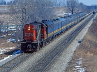 Approaching Frank's Lane, CN 3114 RS18 is in charge of VIA's Toronto-Windsor train 73 at mile 6.5 on the CN's Strathroy Sub.