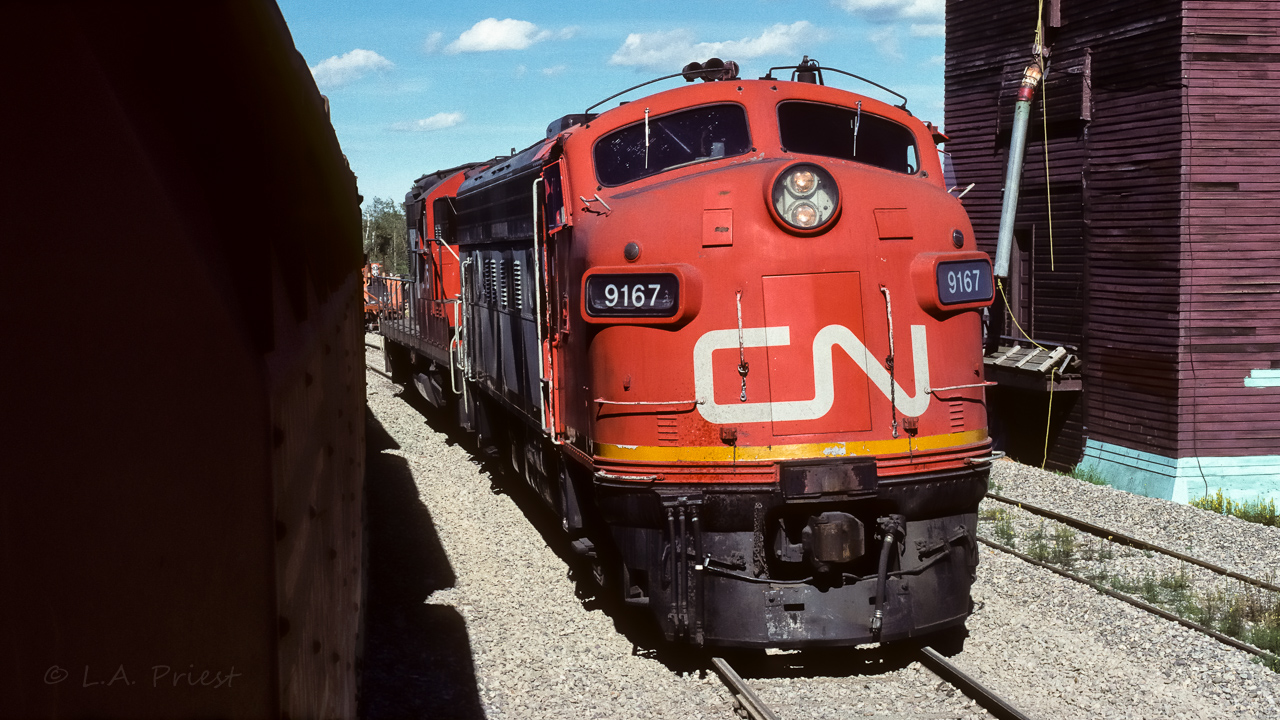 While the crew goes in for dinner at 17:00, why not take a few sunny nose photo's. You can see the extent of the section work, all tracks have been newly ballasted. The section machines are parked on the elevator track, empty ballast cars on the main and units in the siding. Everyone is in at the Redwater Hotel. Many of the people who worked out in the field (oil field etc.) would pull up at the lunch or dinner hour, a favourite haunt.