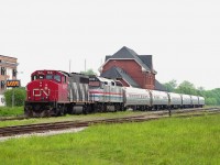 On this day AMTK #97's unit #258 suffered ground relay problems. So, CN 9647 brought it down to Niagara Falls station.  Didn't hang around to see if Conrail came over to take it into the States because I had to get ready to go to work in an hour.
Dull weather gave me the opportunity to shoot this on what would have normally been the "wrong side" if the sun had been out.  I'm using 120 Fuji Velvia print film, which gives strong green, and it helps the image on grayish days. Mamiya 645E medium format.