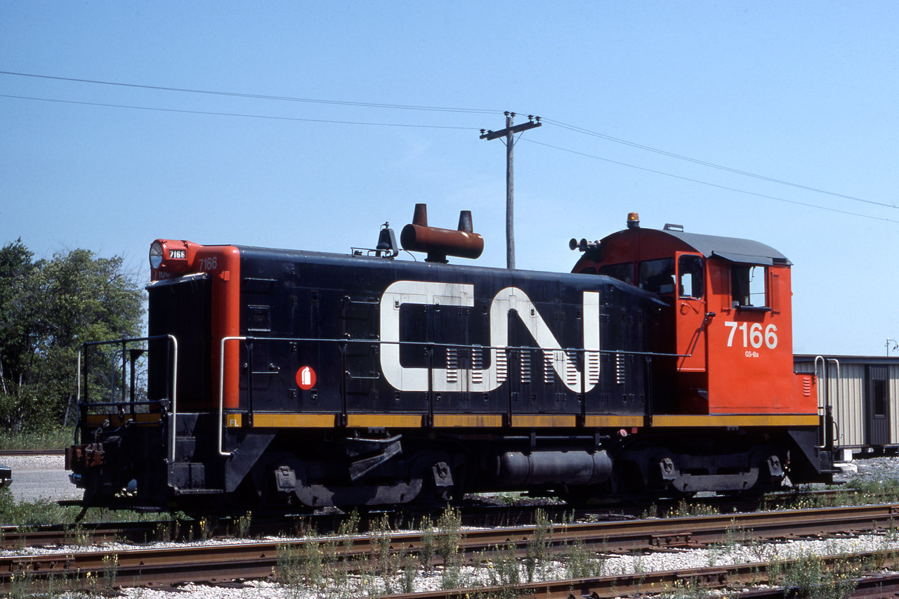 SW 7166 sits in the Dain City CN/Norfolk Western (Southern) Intermodal Yard.  In later years the operation was one of the very few container operations in Ontario.  If you needed a train fix on the drive from Welland to Port Colborne, Dain City was guaranteed to please with what seemed like endless shunting of Intermodal cars that blocked Canal Bank St./Kingsway just south of the John Deere Plant (originally called DAIN MFG. - hence the town name Dain City).  Intermodal / Container operations ended here in 1998.  Dain City was also referred to as Welland Junction, as the CNR Cayuga Sub (Canada Air Line), and CNR Humberstone Sub (Welland Railway) intersected on diamond. You can still see remnants of the original Humberstone Sub that dead ends on the north side of Forks Road E.  VERBIO Bio-Diesel stores tank cars on that section. The Dain City area is set to undergo an incredible transformation as a housing redevelopment on the former John Deere site. The community has been disconnected from Port Colborne since the Forks Road Bridge was removed in 2019 for safety concerns, but a new bridge should be up by 2024.