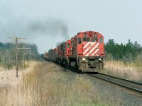 The sun was setting on these hulking MLW M-636 beasts back in the early 1990s, and so catching them always made my day when out trackside.
In this instance, CP 4703, 5509 and 4736 made for a nice head-end consist as they approached Concession 7, township of Puslinch, heading west,  on a pleasant sunny afternoon.
This crossing was the scene of a major wreck back in the mid-70s, with two new SDs ending up in the swamp on the right side in this image. Some of you older dudes may remember it.