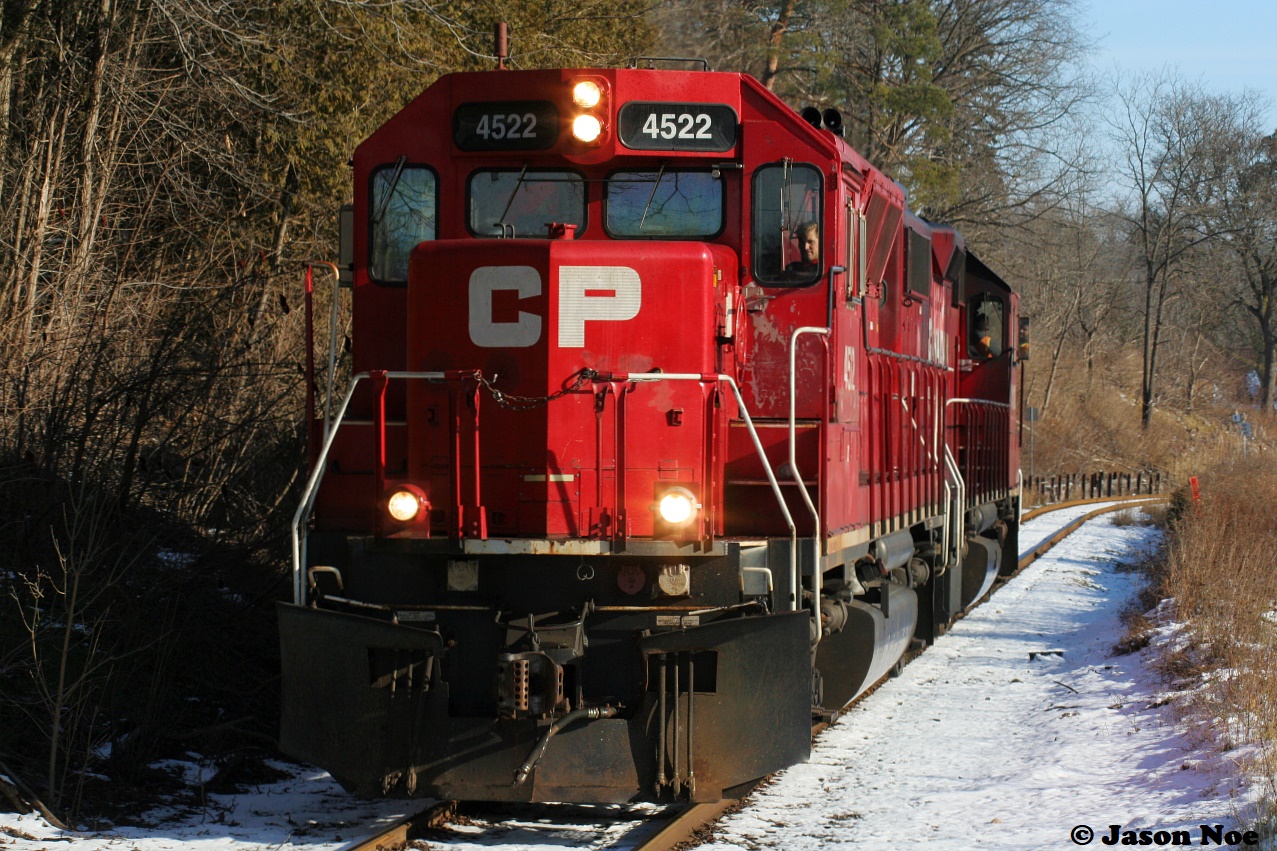 Canadian Pacific’s T-97 (at least I think it still was a T-Series assignment then) with CP 4522, which had started out as a UP GP40X and CP GP38-2 3113 are returning back to Cambridge at a leisurely pace. They are parallelling old King Street in Kitchener, Ontario approaching Mile 8 on the Waterloo Subdivision. The pair had set-off cars for CN at the interchange at South Junction in Kitchener before departing light power to Hagey yard.