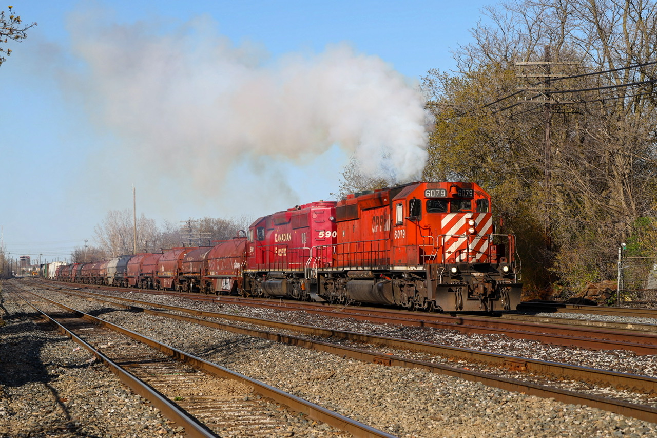 CP CWR-07 with CP 6079 & CP 5901 notching up by Mile 199 Belleville Sub after got good pull by inspection at McCowan.