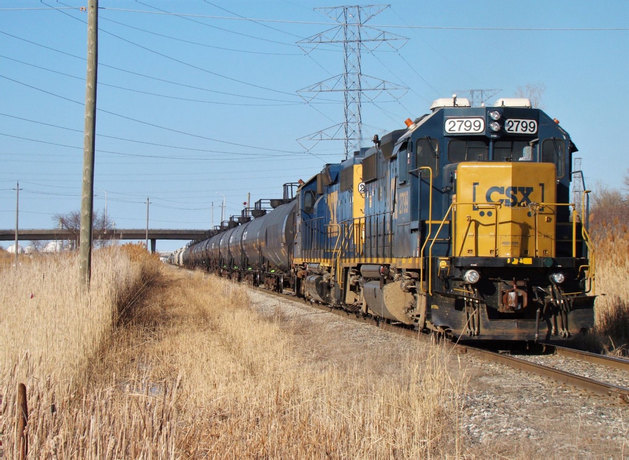 CSX 2799 and CSX 2651 are seen here shoving into Sarnia Yard with 80+ cars they picked up from CN on a pleasant late winter day. This area is often tight with security from the nearby refineries, however during the COVID lockdowns there seemed to be a lack of human activity in the area, making it more comfortable to shoot trains.
