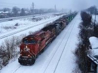It's a windy and snowy morning as a 554-axle long CP 2-230 passes through Beaconsfield with a lot of power, including four SD70M-2s for New Brunswick Southern. Full lashup is CP 8171, CSXT 3188, CP 8932, NBSR 6407, NBSR 6408, NBSR 6409 & NBSR 6411.