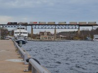 CN Q109 flies over the town of Parry Sound on its way north (and eventually east) to Vancouver. The massive trestle is actually part of the Canadian Pacific Parry Sound Subdivision, which hosts CN northbounds as part of a directional running agreement between the 2 companies. Completed in 1907, the trestle is the longest rail bridge in the province and provides a spectacle to the otherwise sleepy town below it.