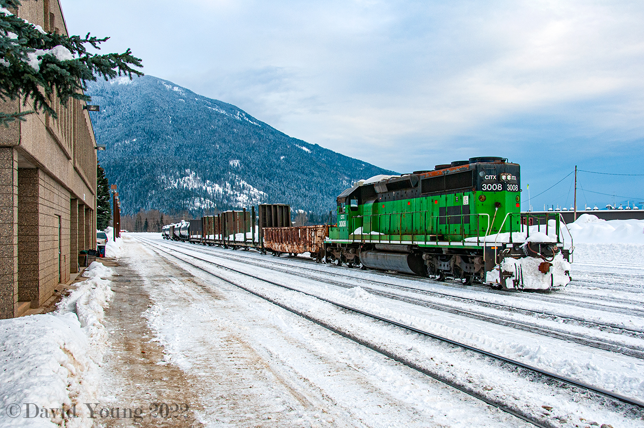 Paused out front of the depot in downtown Revelstoke during yard spreading operations seen  here, SD40-2 CITX 3008 showcases her former owners colours as she idles away with a string of random local cars consisting of an OCS gon followed by 3 bulkhead flats presumably destined for Bell Pole west of town with 4 tank cars of propane for the local fueling company bracketing a b/o coal hopper. CITX 3008 would be purchased by Norfolk Southern and sport painted up in an Operation Livesaver scheme in late 2013/ early 2014, retired and sold in July 2020 to Progress Rail and appears to be have been scrapped as of 2021.