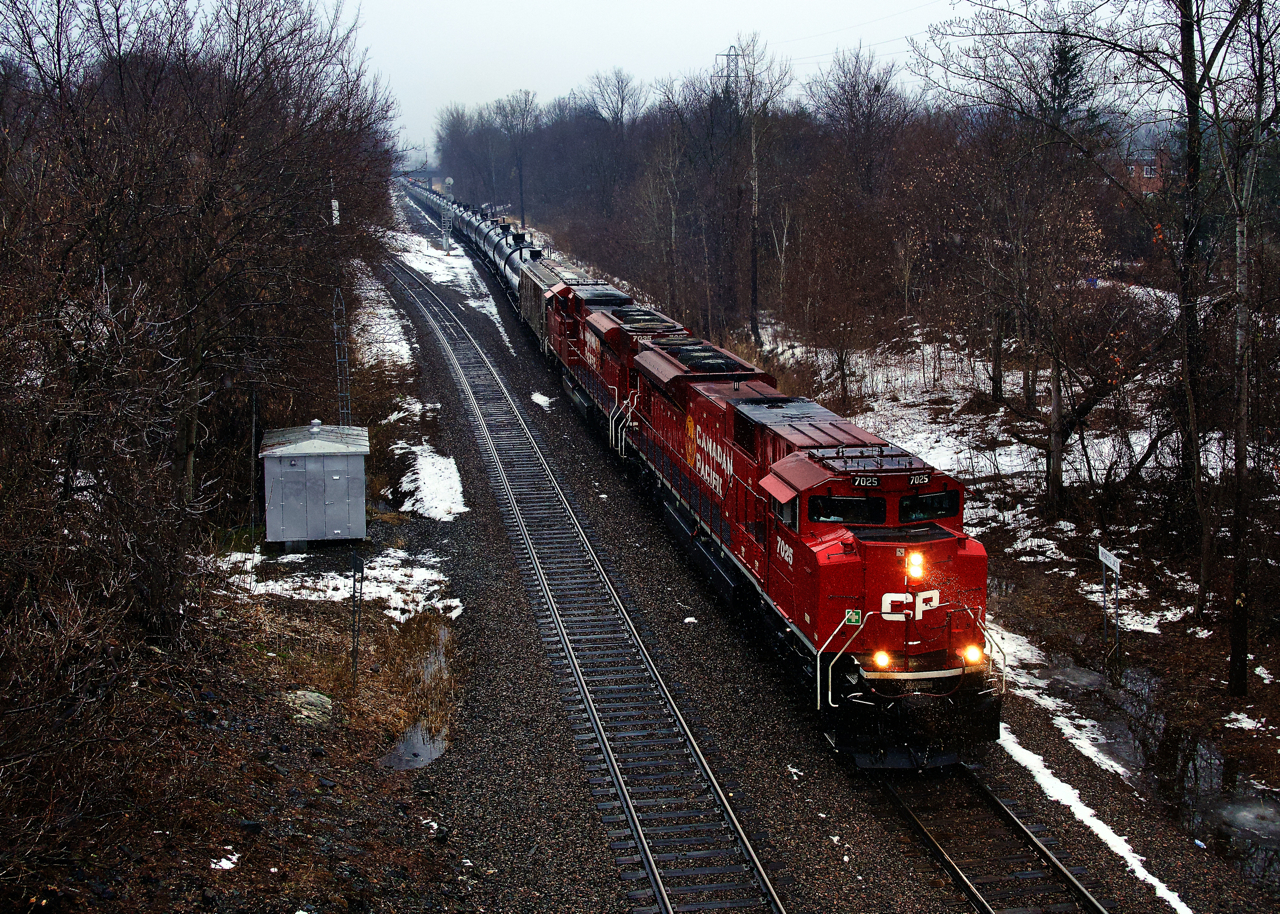 Empty ethanol train CP 529 has SD70ACUs CP 7025 & CP 7035 as it passes North Jct on a wet morning.