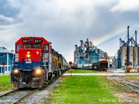 On a day that has given us everything from sun to rain, to sleet and snow along with a constant stiff wind blowing off Lake Huron, a rainbow appears above the crew of GEXR 433 as they prep to depart for the P&H elevator located at the end of track at Centralia to spot 17 cars. Having switched Hensall extensively for the previous 2 hours, collecting the pulls from the towns elevators including a lengthy string from WG Thompsons (out of frame, behind me) and setting off the locals, they will leave town with every track in town plugged with much more work to do on the return trip.... but that will be the recrews problem to deal with after relieving this crew at Centralia.