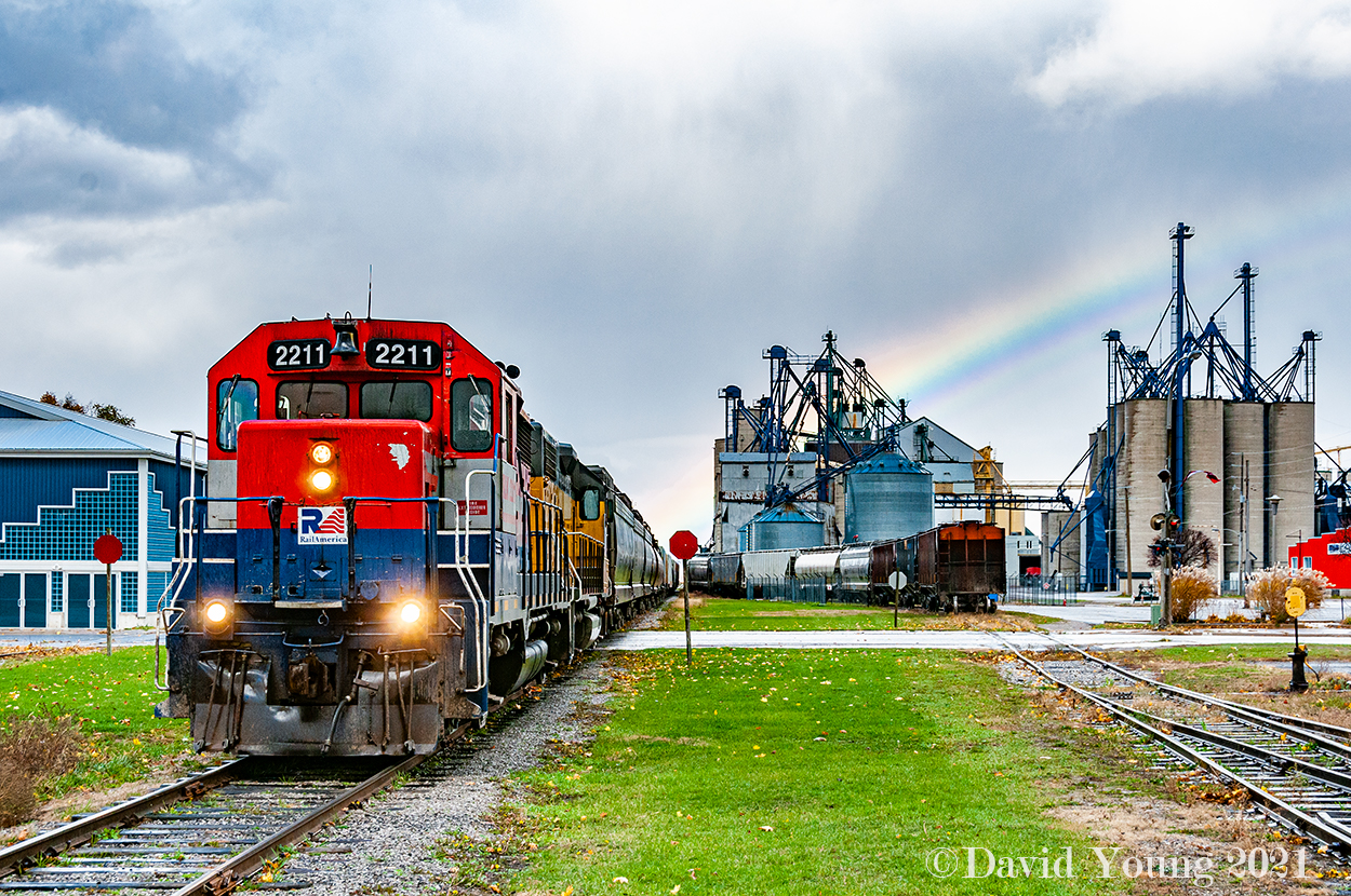 On a day that has given us everything from sun to rain, to sleet and snow along with a constant stiff wind blowing off Lake Huron, a rainbow appears above the crew of GEXR 433 as they prep to depart for the P&H elevator located at the end of track at Centralia to spot 17 cars. Having switched Hensall extensively for the previous 2 hours, collecting the pulls from the towns elevators including a lengthy string from WG Thompsons (out of frame, behind me) and setting off the locals, they will leave town with every track in town plugged with much more work to do on the return trip.... but that will be the recrews problem to deal with after relieving this crew at Centralia.