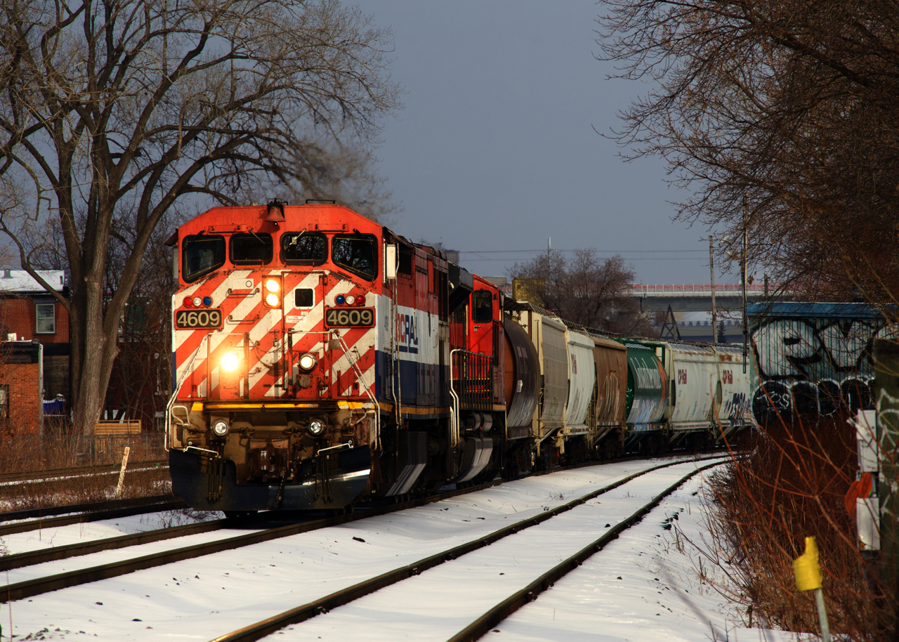 The very last active cowl on CN's roster is leading CN 527 as it awaits a meet with VIA 62 before it sets off and lifts car at Pointe St-Charles Yard. Up front are some older grain hoppers, which probably won't be around too much longer, just like BCOL 4609.