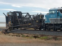 SD40-2F CMQ 9010 and Jordan Spreader CP 402998 are in the process of cutting away some soil and ballast on the north side of the main between Morse and Herbert SK on the Swift Current Sub.  Perhaps prepping for winter and the subsequent spring runoff? I wont pretend to know. 