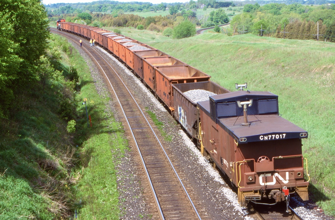 The old and sadly long gone wooden bridge east of Newtonville allowed some nice shots of a ballast train with SD40U 6024 for power slowly working the north track. Of course the old van now just a rider car was the real highlight.