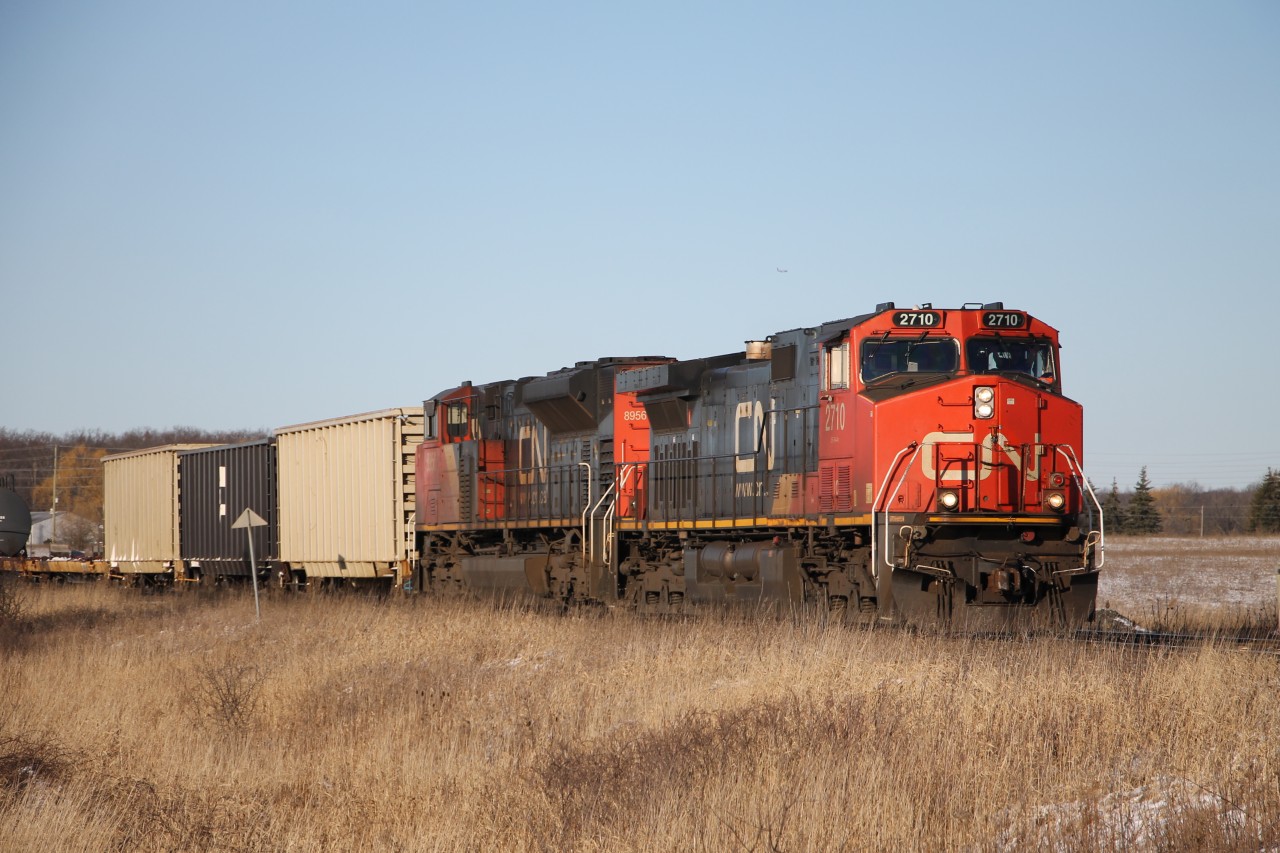 IC 2710, CN 8956 have just passed the Station One Mile Sign for Tansley as A435 heads down the North Track, Halton Sub. at Mile 42.20 about to enter No. 1 Sideroad crossing.