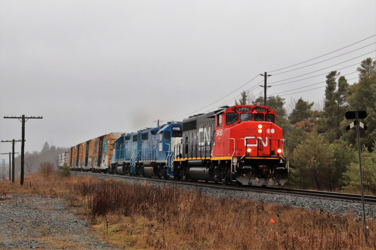 I was headed to get my grandson from school and was stopped at the red light at Watson road and York when across the street the railroad signals started flashing. I jumped out the car and grabbed the camera and around the bend came this guy.  CN 9450 with CN 4908 and CN 4906 flying by was a nice surprise because at 2:30pm there is usually nothing to be found. A little luck never hurts.