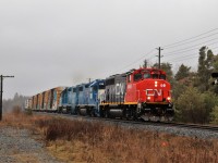 I was headed to get my grandson from school and was stopped at the red light at Watson road and York when across the street the railroad signals started flashing. I jumped out the car and grabbed the camera and around the bend came this guy.  CN 9450 with CN 4908 and CN 4906 flying by was a nice surprise because at 2:30pm there is usually nothing to be found. A little luck never hurts.