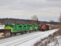 Almost every railfan was out for the arrival of CP 230 with its four nice green passengers headed to the east coast and after an interesting trip to Wolverton, it finally made its way east. I was standing on the bank patiently waiting listening to the scanner and heard CP 137 get a clearance with the "after CP 8171 clears'. I didn't think much of it until After about 20 minutes nothing had shown. I heard the horn for CP 230 in the distance at the 14th concession and then heard on scanner 8073 West calling out Guelph Junction. I immediately thought CP 137 was going to block me out of CP 130. The headlight for CP 230 appeared at Mountsberg road and the headlight of CP 137 rounded the bend at Twiss. Luckily CP 137 was slowing for the red signal at the junction so I managed to get my shots. I put the camera through a sumac tree and caught the good part of the meet through the tree.  CP 8073 with CP 8623, (CP 137) glides past the quartet of NBS 6407, EM 6408, MN6409 and EM 6411. 