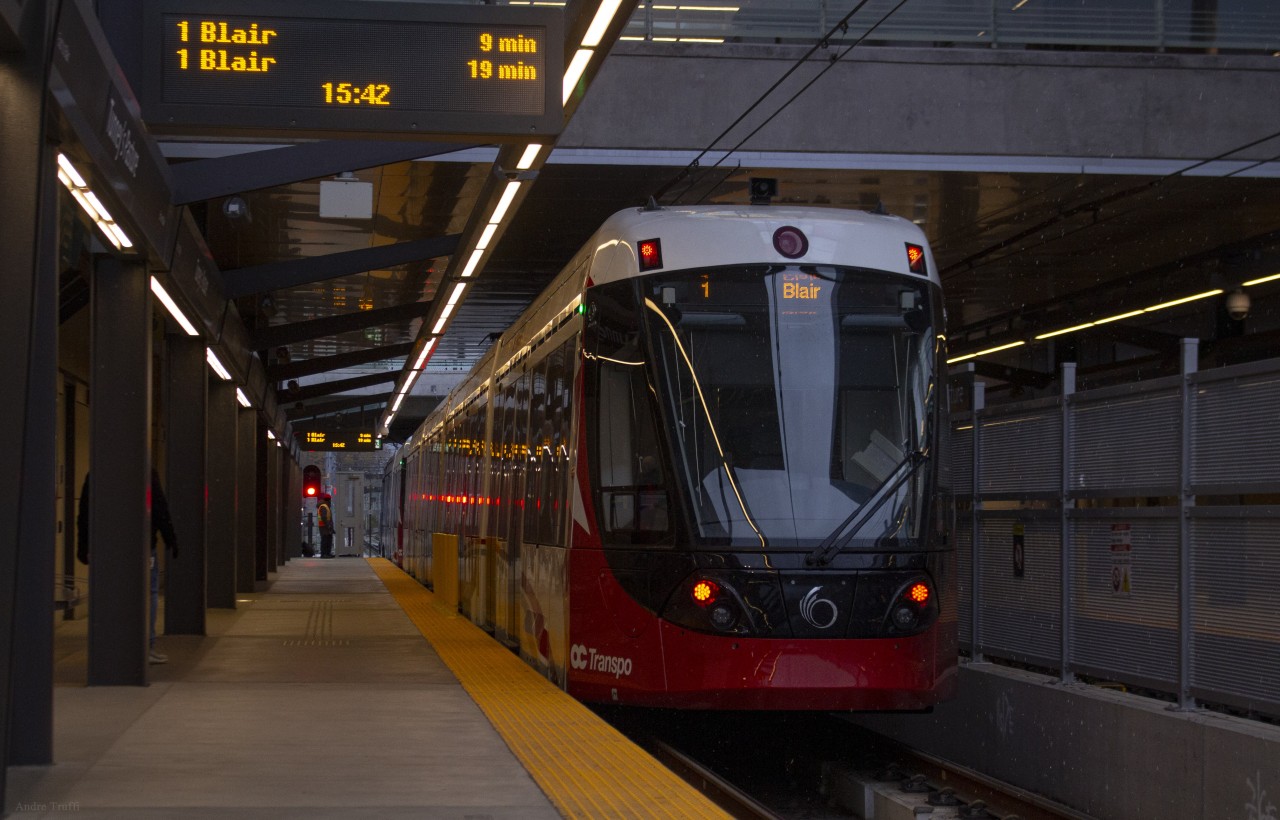 OC Transpo LRT vehicle number 1106 leaving Tunney's Pasture station on opening day of the Confederation Line in Ottawa.