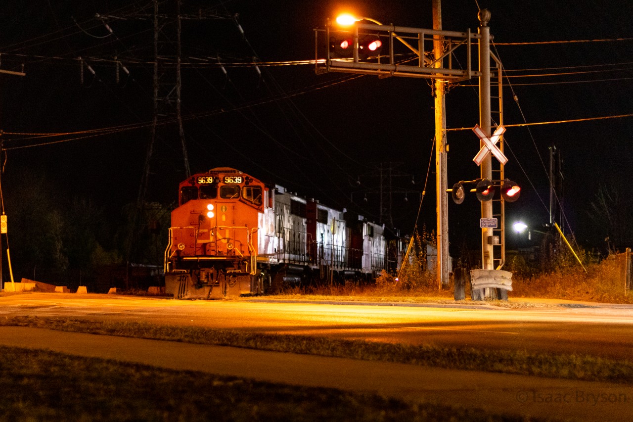 The clock strikes 1am in Scarborough so of course it's only natural that I am out railfanning. CN L546 is reversing past Birchmount Avenue into Home Lumber to lift around a dozen cars before spotting another dozen later in the light. CN 546 this night is made up of CN 9639, CN 4798, CN 4709, and ONT 1603. 1603 is en route to the York-Durham Heritage Railway, nearly 2 weeks after the original planned delivery date. It would take another 2 weeks for 1603 to get to the YDHR and by then, "mechanical issues" had sidelined the tourist train for the season. The crew was mostly cheerful throughout the night (they might have been tipped off that railfans were going to be around) and the 4 of us shooting it enjoyed a relatively calm night of chasing.