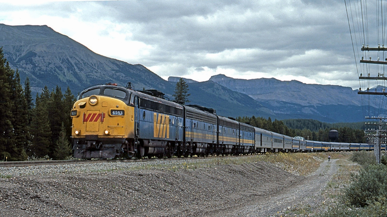 FP7A, VIA 6553 departs lake Louise with the westbound Canadian. A scene not to be repeated today, not only is the power different and the consist now all stainless steel but in 1990 the Canadian was rescheduled to CN's more northerly route through Edmonton and Jasper.