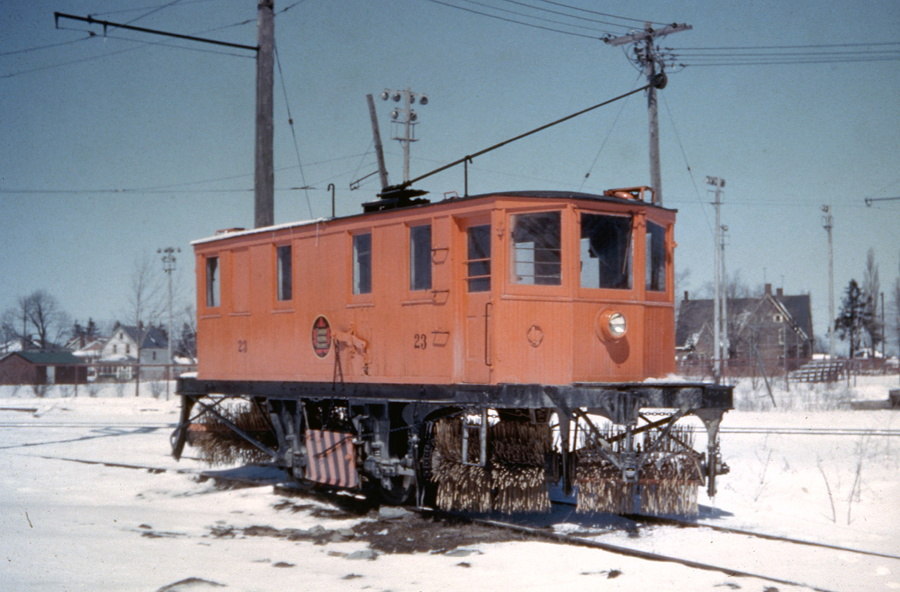 Prolific railway enthusiast Al Chione has provided us this duplicate image of NS&T Sweeper #23, circa 1955.  The town name was not identified on the slide, but the location is remarkably unchanged nearly 70 years later.  The NS&T had a Wye connection to the Canada Cement Spur (west side of Elm) and the catenary can be clearly seen in the image.  #23 is parked on the south side of the Wye, a location where she often resided.  Behind the unit is the Lion's Field Ball Diamond, one of the few such parks that enjoyed lights in the mid-50's.  Beyond that, the large home that can be seen, still stands but a modern apartment building was built around the property perimeter (Elm and Killaly Street), so the house is less pronounced now.... the great Detroit Rocker Bob Seger would likely characterize this scene today as "Still the Same"...minus the track and associated catenary of course.  Thanks to Steve H for helping out with this and some other recent posts...