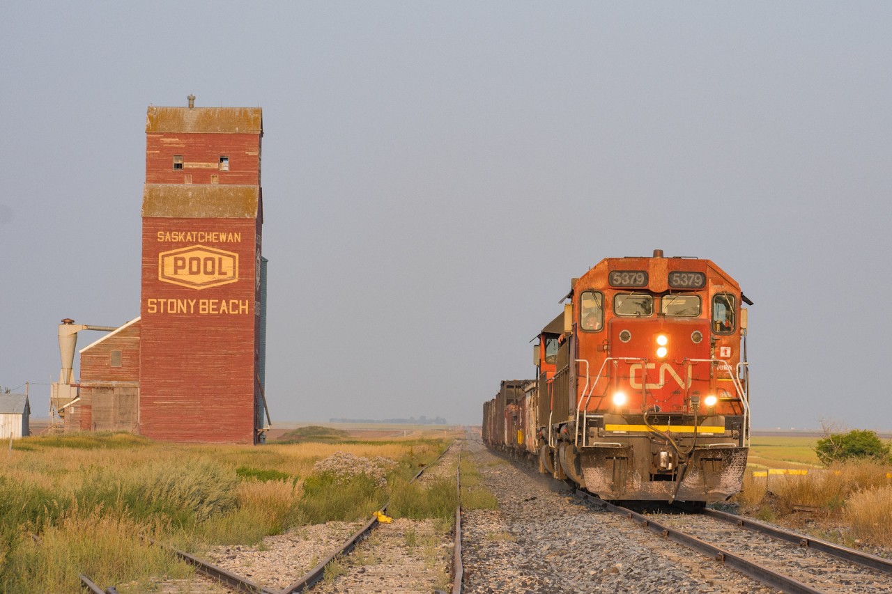 CN 5379 leads the nearly daily L556 turn out of Regina to Moosejaw passing one of the nicest Pool elevators in Saskatchewan