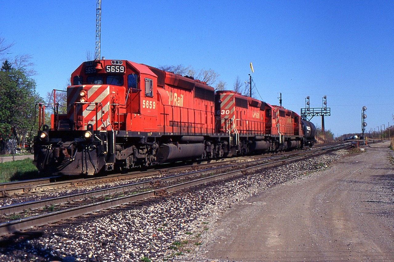 NS 328 with three CP SD40-2s and one tank highballs through Port Robinson Eastbound for Buffalo from St. Thomas.